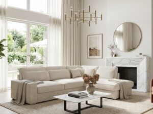 Salon moderne avec canapé d'angle beige, table basse en marbre et fauteuil terracotta devant une grande fenêtre lumineuse.